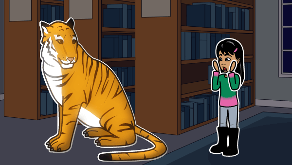 A little girl looks in shock at a tiger, who is sitting in the library. She has dark hair and wears a green and pink shirt.