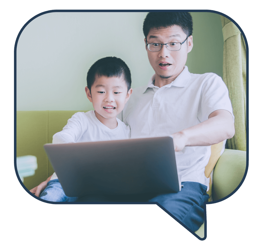 Excited dad with his son looking at a computer